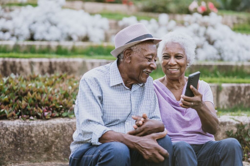 Senior couple laughing at a park